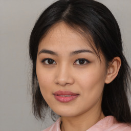 Joyful asian young-adult female with medium  black hair and brown eyes