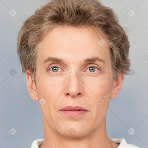 Joyful white adult male with short  brown hair and grey eyes