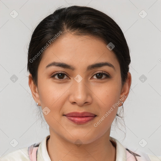 Joyful latino young-adult female with medium  brown hair and brown eyes