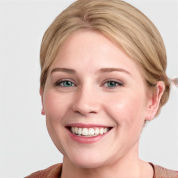 Joyful white young-adult female with medium  brown hair and blue eyes