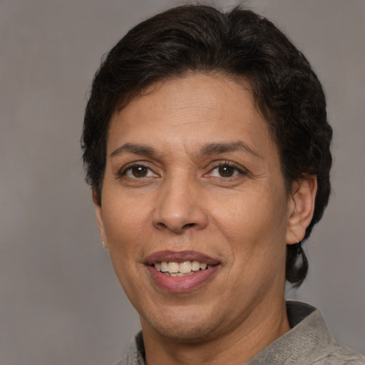 Joyful white adult female with short  brown hair and brown eyes