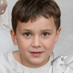 Joyful white child male with short  brown hair and brown eyes