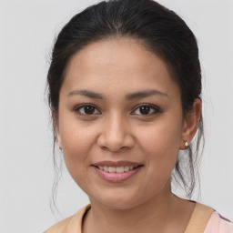 Joyful white young-adult female with medium  brown hair and brown eyes