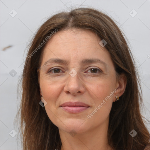 Joyful white adult female with long  brown hair and brown eyes