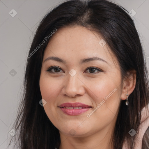 Joyful white adult female with long  brown hair and brown eyes