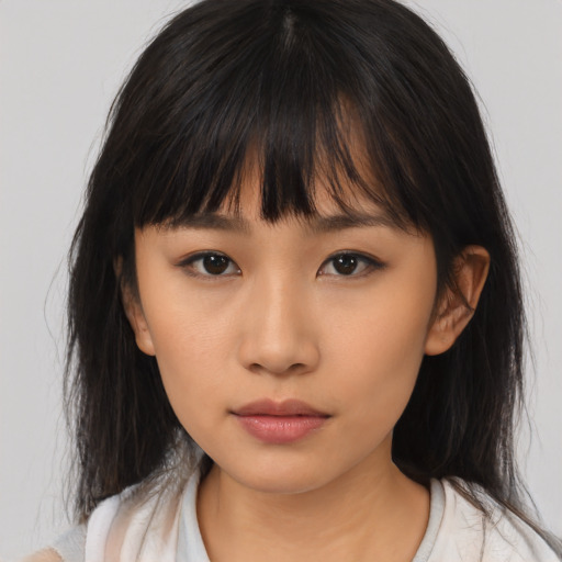 Neutral asian young-adult female with medium  brown hair and brown eyes