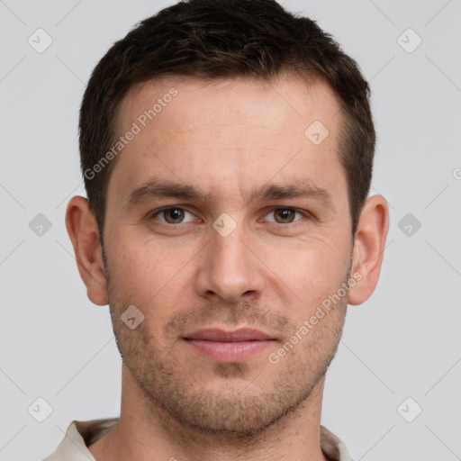 Joyful white young-adult male with short  brown hair and grey eyes