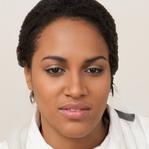 Joyful latino young-adult female with short  brown hair and brown eyes