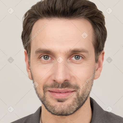 Joyful white adult male with short  brown hair and grey eyes