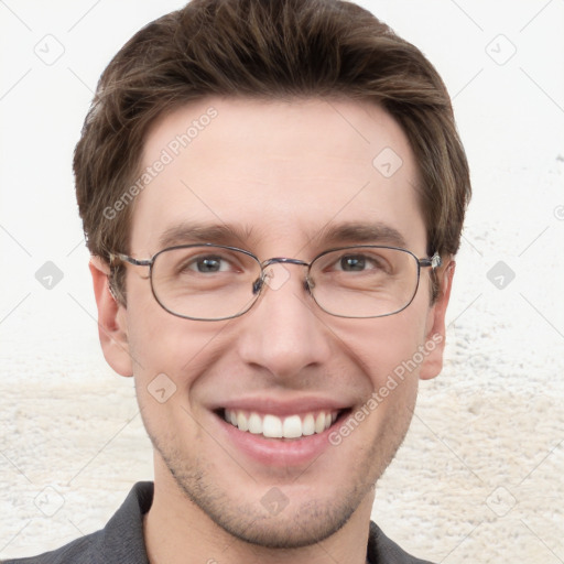 Joyful white adult male with short  brown hair and grey eyes