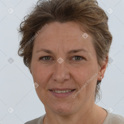 Joyful white adult female with short  brown hair and brown eyes