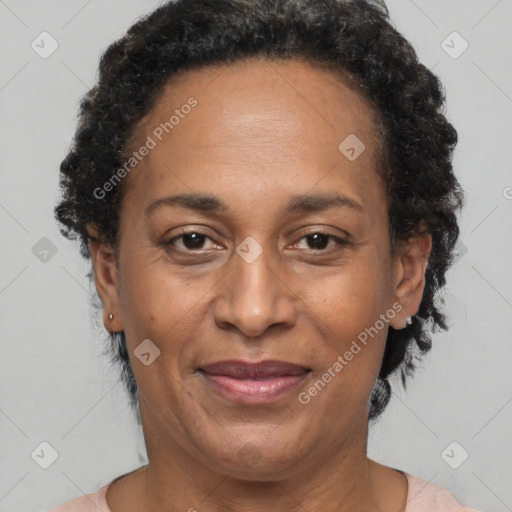 Joyful black adult female with short  brown hair and brown eyes