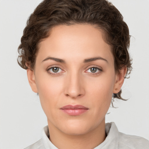 Neutral white young-adult female with short  brown hair and brown eyes