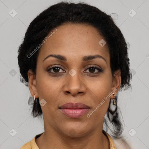 Joyful black adult female with medium  brown hair and brown eyes