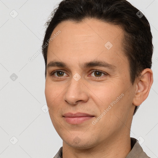 Joyful white young-adult male with short  brown hair and brown eyes