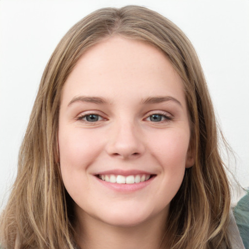 Joyful white young-adult female with long  brown hair and blue eyes