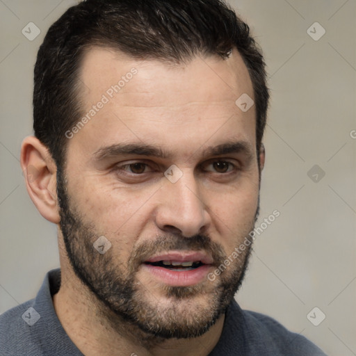 Joyful white adult male with short  black hair and brown eyes