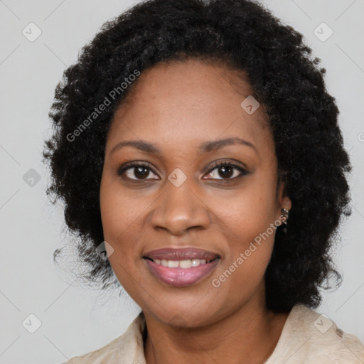 Joyful black young-adult female with long  black hair and brown eyes