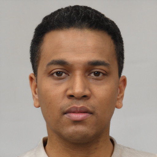 Neutral latino young-adult male with short  black hair and brown eyes