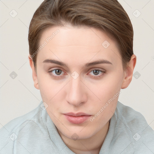 Neutral white young-adult female with short  brown hair and brown eyes