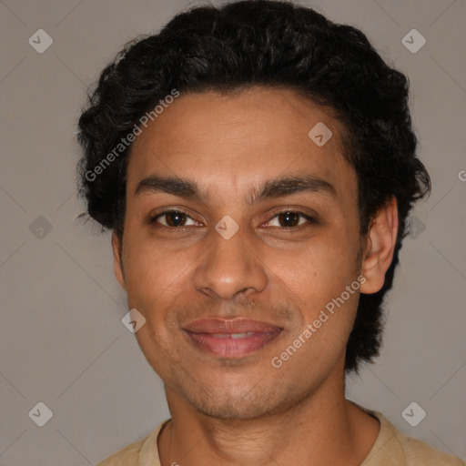 Joyful latino young-adult male with short  brown hair and brown eyes