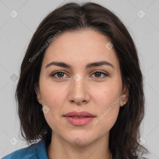 Joyful white adult female with medium  brown hair and brown eyes