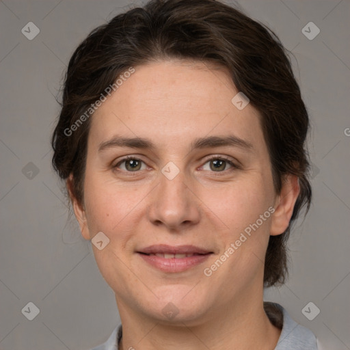 Joyful white adult female with medium  brown hair and grey eyes