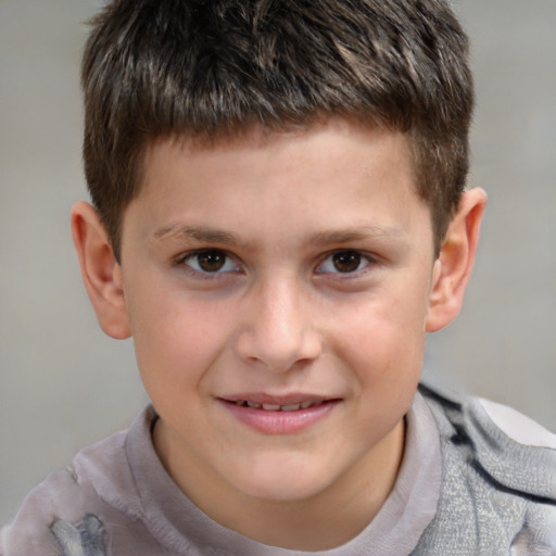 Joyful white child male with short  brown hair and brown eyes