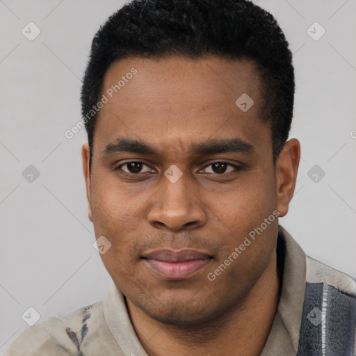 Joyful black young-adult male with short  black hair and brown eyes