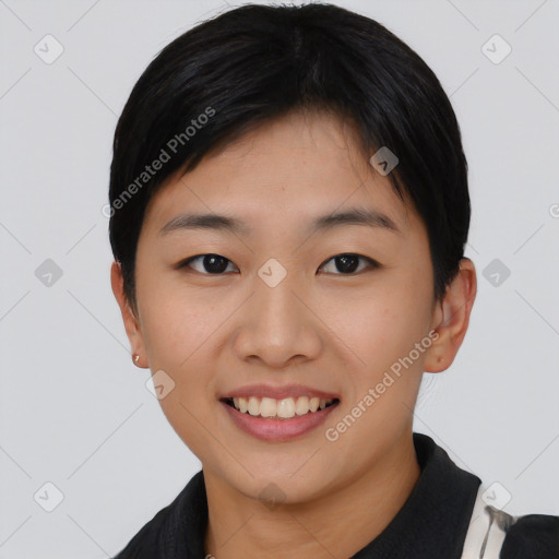 Joyful asian young-adult female with short  black hair and brown eyes