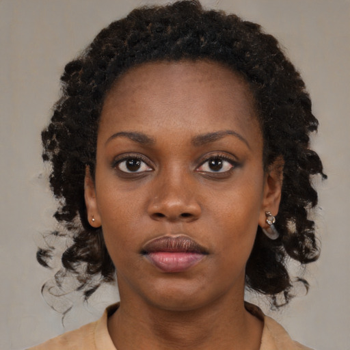 Neutral black young-adult female with medium  brown hair and brown eyes