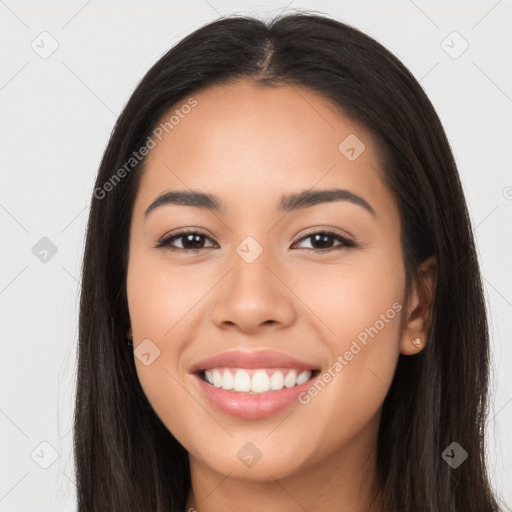 Joyful latino young-adult female with long  black hair and brown eyes