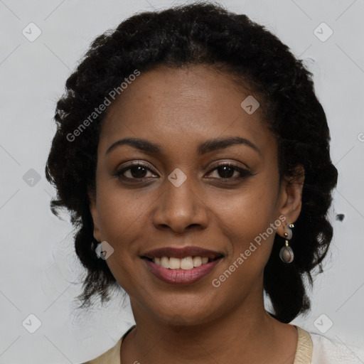 Joyful black young-adult female with medium  brown hair and brown eyes