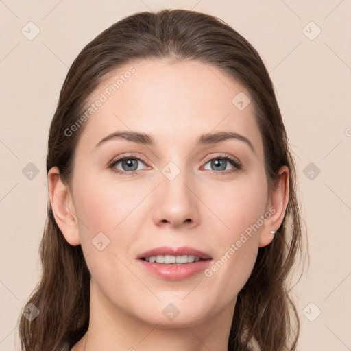 Joyful white young-adult female with long  brown hair and grey eyes