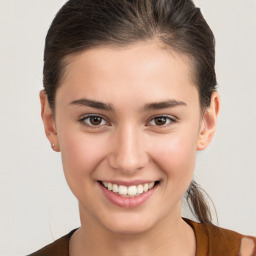 Joyful white young-adult female with medium  brown hair and brown eyes