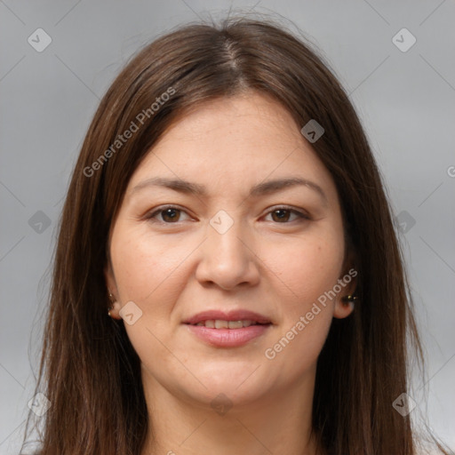 Joyful white young-adult female with long  brown hair and brown eyes