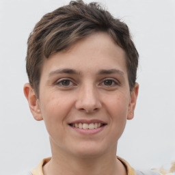 Joyful white young-adult female with short  brown hair and grey eyes