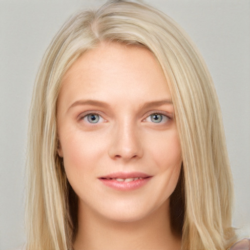 Joyful white young-adult female with long  brown hair and blue eyes