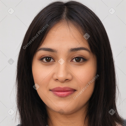 Joyful latino young-adult female with long  brown hair and brown eyes