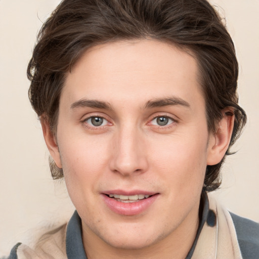 Joyful white young-adult male with medium  brown hair and brown eyes