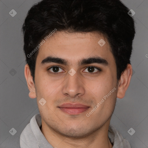 Joyful latino young-adult male with short  brown hair and brown eyes