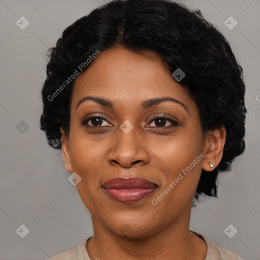 Joyful latino adult female with short  black hair and brown eyes