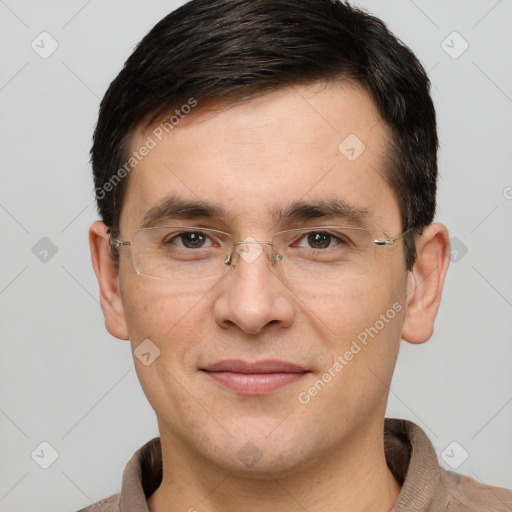 Joyful white adult male with short  brown hair and brown eyes