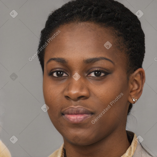 Joyful black young-adult female with short  brown hair and brown eyes