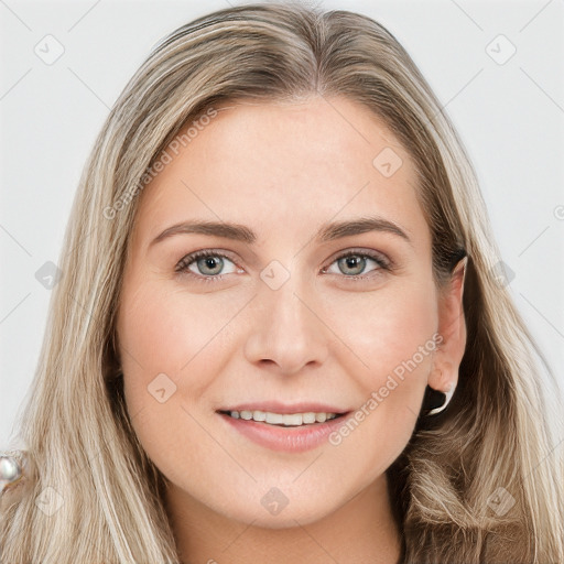 Joyful white young-adult female with long  brown hair and blue eyes