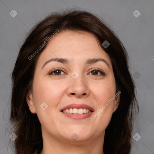 Joyful white adult female with medium  brown hair and brown eyes