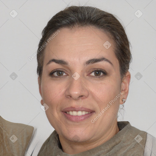 Joyful white adult female with short  brown hair and brown eyes