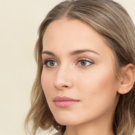 Neutral white young-adult female with long  brown hair and green eyes