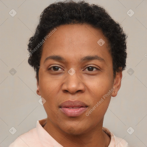 Joyful black adult female with short  brown hair and brown eyes