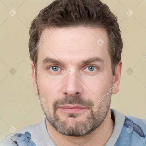 Neutral white adult male with short  brown hair and grey eyes